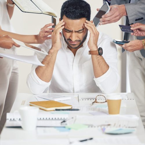 Business, employee and man with a headache, multitasking and stress with documents, deadline or schedule. Male person, consultant or company director with a migraine, overworked or burnout with chaos.